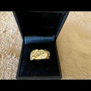 This is a nice 14k mens size 10 ring with a genuine diamond,